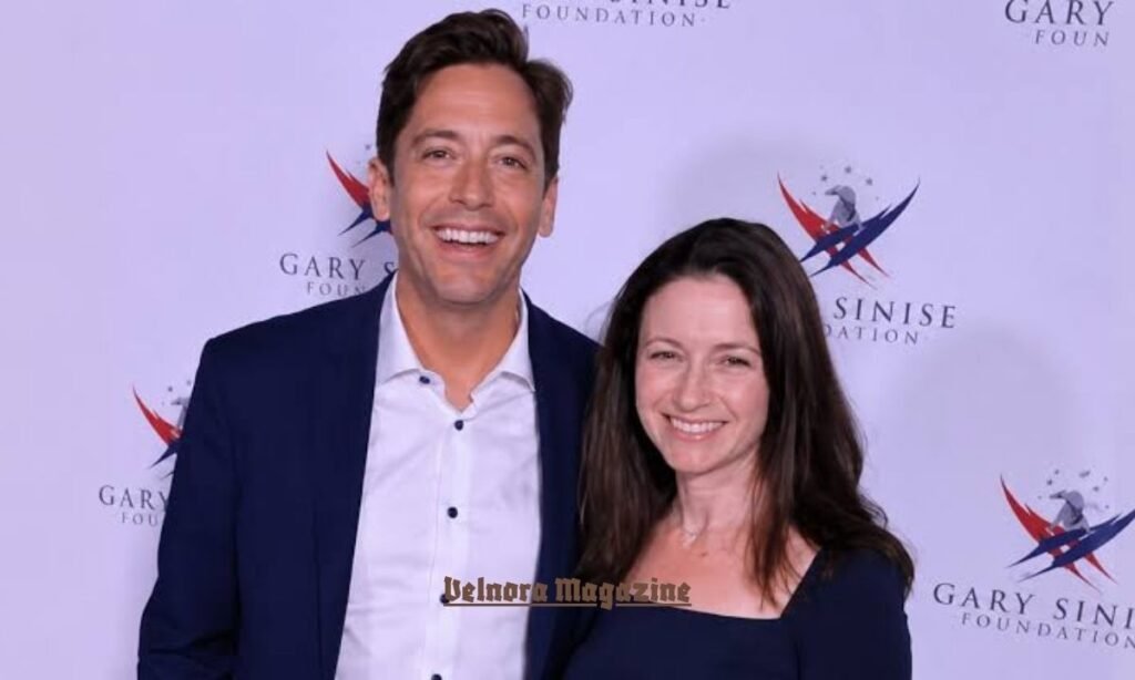 Alissa Mahler standing next to her husband Michael Knowles in a formal event setting.